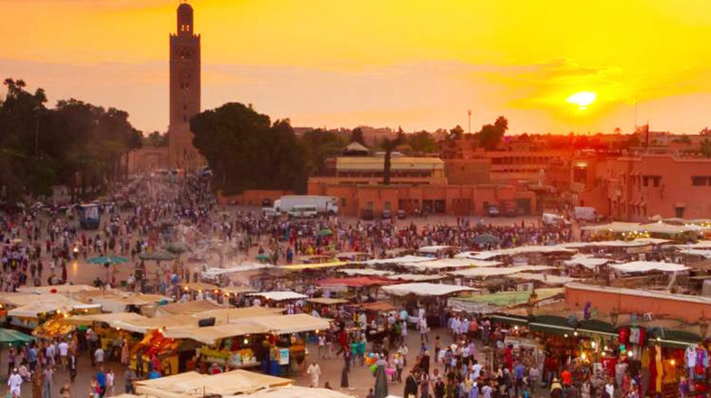 Traveler exploring the colorful streets of Morocco safely during a guided vacation tour