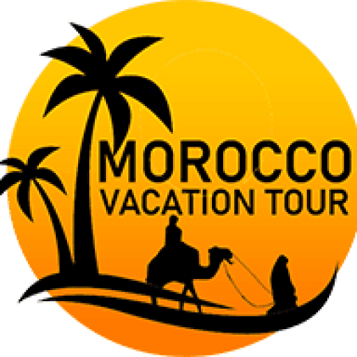 Sunset over Sahara Desert dunes with camel caravan in Morocco